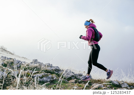 Trail Runner in Misty Mountain Landscape Trail Runner in Misty Mountain Landscape 125283437
