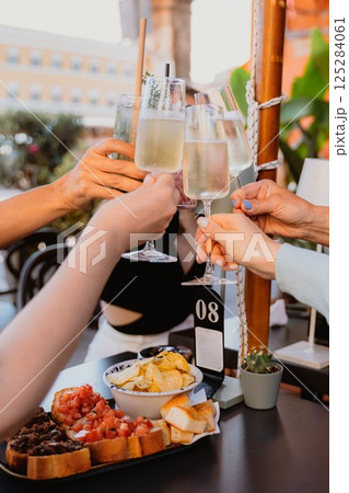 Group of people sharing a celebratory toast 125284061