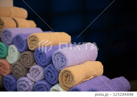 Neatly folded colorful towels arranged in a hospital room, providing comfort and hygiene for patients 125284896
