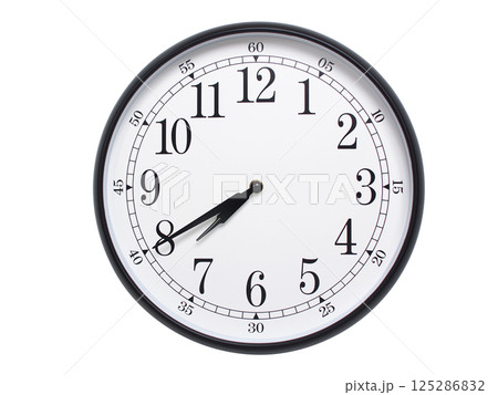 Round wall clock with black frame showing time at 07:40 or 19:40. Ideal for concepts of time or scheduling. 125286832