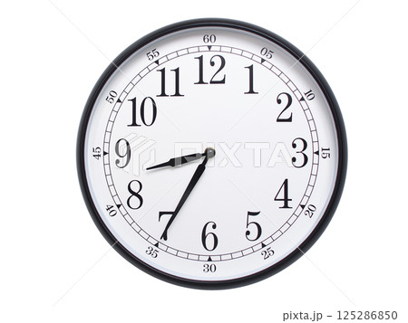Round wall clock with black frame showing time at 08:35 or 20:35. Ideal for concepts of time or scheduling. 125286850