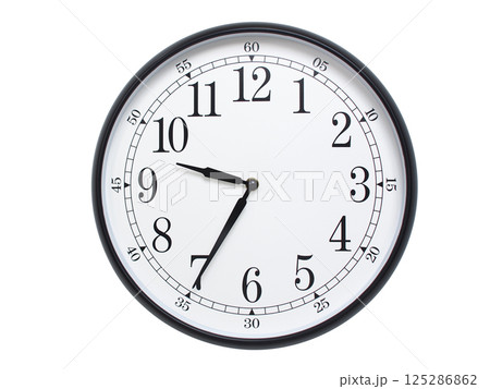 Round wall clock with black frame showing time at 09:35 or 21:35. Ideal for concepts of time or scheduling. 125286862