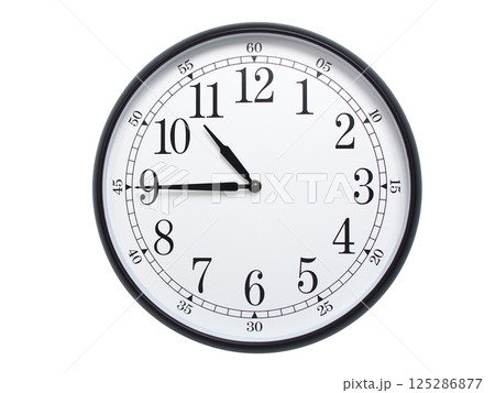 Round wall clock with black frame showing time at 10:45 or 22:45. Ideal for concepts of time or scheduling. 125286877