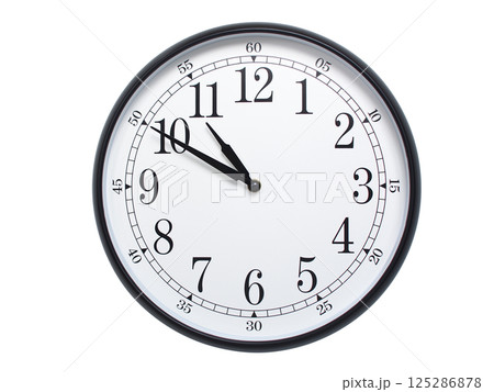 Round wall clock with black frame showing time at 10:50 or 22:50. Ideal for concepts of time or scheduling. 125286878