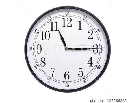 Round wall clock with black frame showing time at 11:15 or 23:15. Ideal for concepts of time or scheduling. 125286883