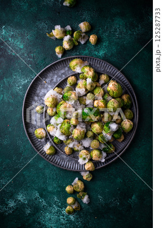 Frozen Brussels sprouts on dark background 125287733