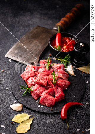 Raw beef meat and ingredients for cooking 125287747
