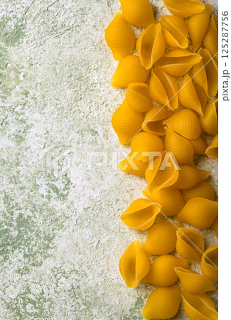 Raw pasta in shape of shells Raw pasta in shape of shells 125287756