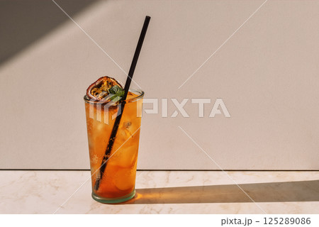 A steamed glass with a tasty carbonated drink and passion fruit A steamed glass with a tasty carbonated drink and passion fruit 125289086