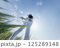 Charming Korean woman against blue sky with clouds. Freedom 125289148