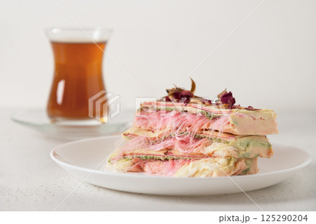 Trendy pink chocolate with airy filling on marble board. Trendy pink chocolate with airy filling on marble board. 125290204