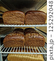 Freshly baked bread on trolley in bakery 125292048