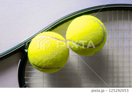 Tennis balls and raket against white background Top view. Sport concept Tennis balls and raket against white background Top view. Sport concept 125292053