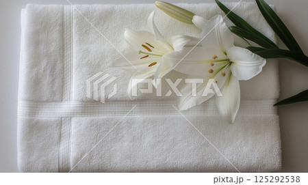 White Lilies Enhance Spa Towels Relaxation and Wellness 125292538
