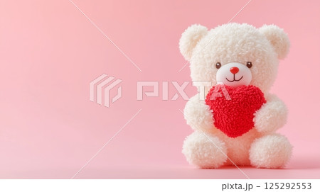 White Teddy Bear Holding Red Heart on Pink Background 125292553