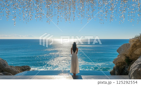 Woman contemplating by the serene ocean view 125292554