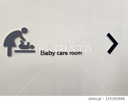 Inclusive baby care room sign in public space. Symbol of support for parents and caregivers. Promotes accessibility, equal opportunity, and family-friendly urban infrastructure 125292666