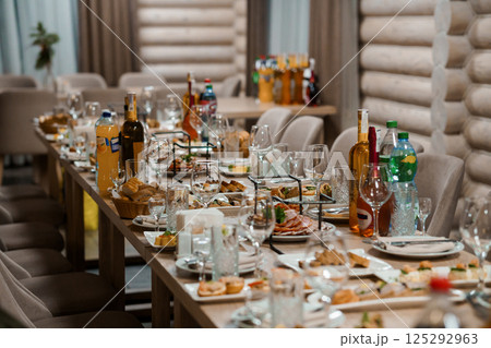 Elegant Banquet Table Set for a Feast with Various Dishes and Beverages 125292963