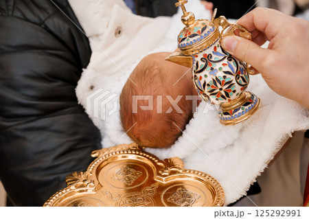 Baptism Ceremony with Ornate Cup and Golden Tray 125292991