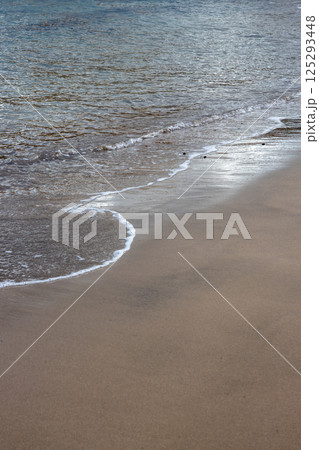 Sand beach and a line of the tide, Gran Canaria, Spain 125293448