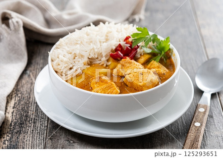 Massaman curry on wooden table. Traditional Thai food recipe 125293651