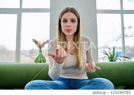 Web cam view of young serious woman talking looking in camera, online meeting, video call 125294783