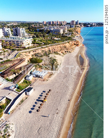 Aerial shot of spanish resort town of Mil Palmeras. Costa Blanca. Spain Aerial shot of spanish resort town of Mil Palmeras. Costa Blanca. Spain 125294805