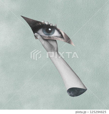 Collage of a hand holding a shard of glass revealing an eye 125294825