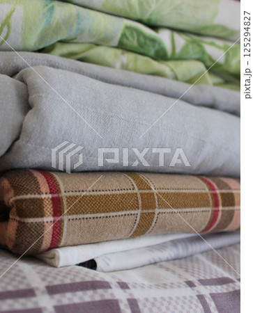Folds Of Cozy Domestic Variety Size And Colors Bedding In Home Closet Folds Of Cozy Domestic Variety Size And Colors Bedding In Home Closet 125294827
