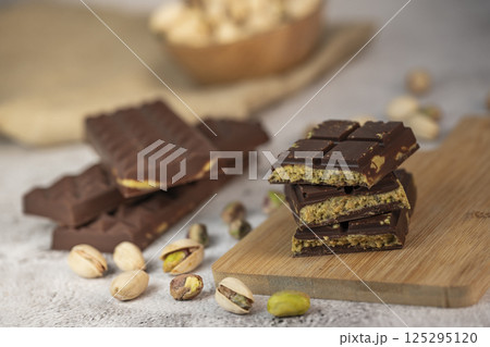 Delicious chocolate bar with pistachio pieces showcased in a Dubai setting, perfect for dessert 125295120