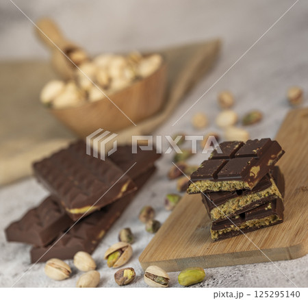 Delicious chocolate bar with pistachio pieces showcased in a Dubai setting, perfect for dessert 125295140