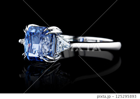 white metal ring, silver, gold with sapphire stone, diamonds on black background 125295893