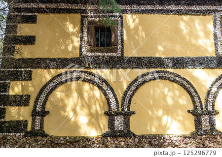 Calvary chapel in the way to the cross, via crucis, trail on ancient forest of Bussaco, in Luso, Aveiro in Portugal. 125296779