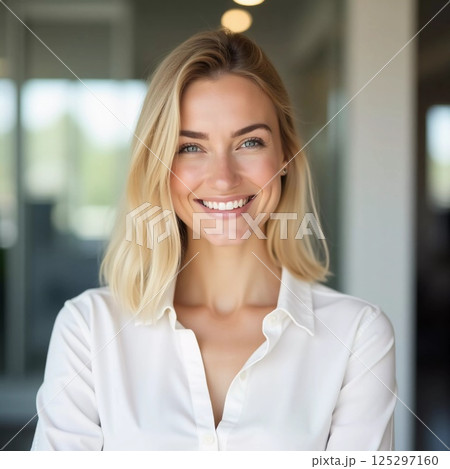 A confident blonde woman with a bright smile stands in a contemporary bank office, ready to assist clients Generative AI 125297160