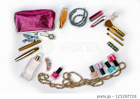 cosmetics, jewelry, perfumes and a beautiful pink cosmetic bag on a white background, top view cosmetics, jewelry, perfumes and a beautiful pink cosmetic bag on a white background, top view 125297728