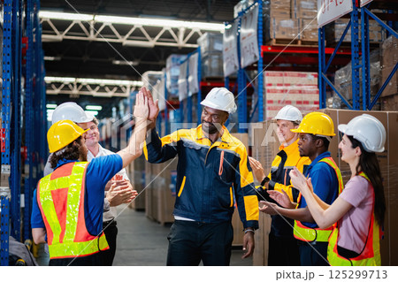 Teamwork of warehouse workers	 125299713