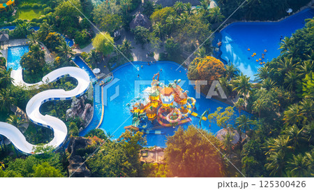 aquapark with slides and a swimming pool at the resort in summer. Entertainment park with water park on VinPearl in Nha Trang in Vietnam aerial top view from drone aquapark with slides and a swimming pool at the resort in summer. Entertainment park with water park on VinPearl in Nha Trang in Vietnam aerial top view from drone 125300426