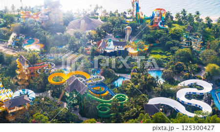 quapark with slides at resort in summer. Entertainment park with water park aerial top view from drone 125300427