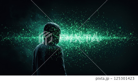 A figure wearing a dark hoodie stands in silhouette against a backdrop of glowing green binary code. The data appears to flow around the figure, symbolizing themes of cybersecurity and technology 125301423