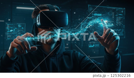 A young individual is immersed in a virtual reality experience inside a modern tech lab. Wearing a VR headset, they are using their hands to interact with glowing holographic elements in mid-air. The 125302216