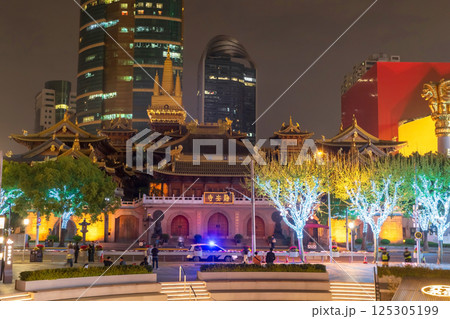 Jingan temple with light up on tree at night in spring, Shanghai, China 125305199