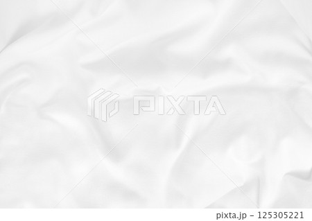 Close up top view of white bedding sheet and wrinkle messy blanket in bedroom after wake up in the morning. Close up top view of white bedding sheet and wrinkle messy blanket in bedroom after wake up in the morning. 125305221