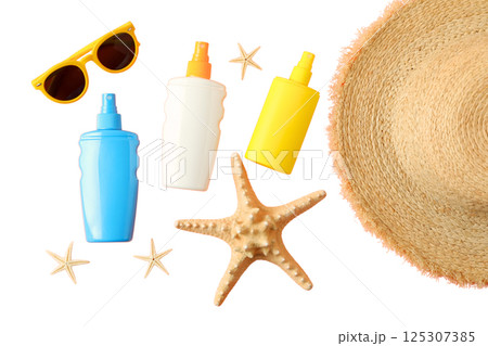 Sunscreen, sunglasses, and a straw hat for summer fun, isolated on white 125307385