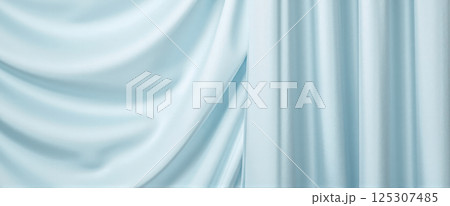 Glossy pale blue silky fabric curtain background with folds for modern clean product advertising and text placement Glossy pale blue silky fabric curtain background with folds for modern clean product advertising and text placement 125307485