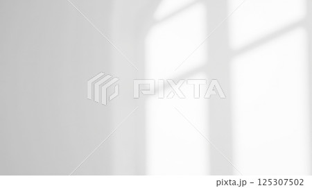 Bright natural sunlight and soft shadows falling on clean white background through window, minimalist design projects and artistic creativity Bright natural sunlight and soft shadows falling on clean white background through window, minimalist design projects and artistic creativity 125307502