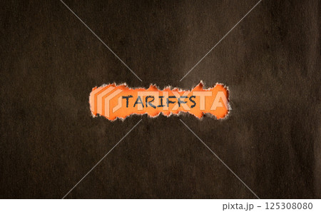 Tarrifs, word on orange paper. Tarrifs, word on orange paper. 125308080