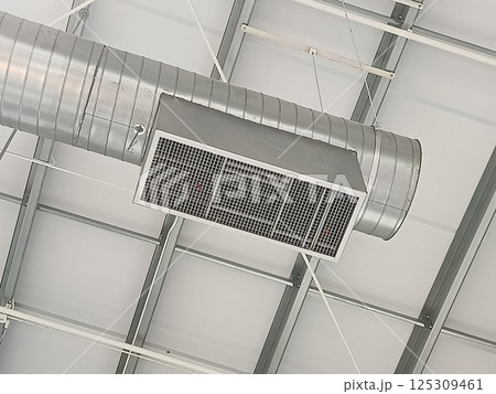 Air vent pipes for cooling air are installed on the building ceiling. Air vent pipes for cooling air are installed on the building ceiling. 125309461