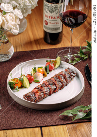 Grilled sliced beef steak with vegetable 125309961