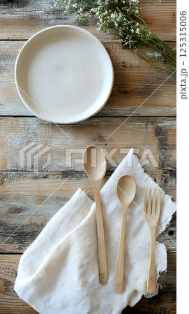 Compostable plate positioned on a rustic wooden table for contrast Compostable plate positioned on a rustic wooden table for contrast 125315006