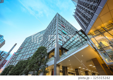 Office Building With Large Windows and Green Trees Dec 7 2024 125315282